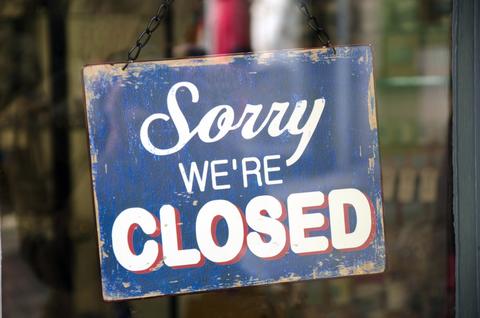 "Sorry we're closed" sign on door